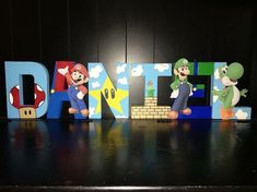 the letters are made up of mario and luigi's characters in front of them