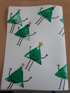 a piece of paper with green trees on it