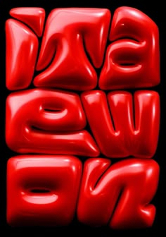 the words love are made out of red plastic balloons in front of a black background