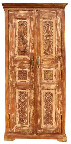 an old wooden armoire with carvings on it