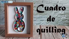 a wooden frame with buttons in the shape of a rabbit on it and text that reads cuadro de quilting