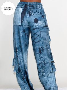 Elevate your casual wardrobe with our Denim Daze Tie Dye Cargo Joggers – a perfect fusion of laid-back comfort and on-trend style. These pants effortlessly blend the classic appeal of denim with the vibrant energy of tie-dye, creating a fashion-forward statement piece that stands out in any crowd.The relaxed fit and cargo detailing add a touch of utility, providing both comfort and functionality. Whether you're lounging at home or heading out for a casual day, these joggers ensure you're on poin Batik Pants, Cargo Design, Trendy Pants, Urban Aesthetic, Tie Dye Colors, Comfortable Style, Cargo Joggers, Urban Style, Urban Chic