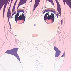 a close up of a person with pink hair and big eyes looking at the camera