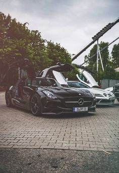 two mercedes sls parked next to each other