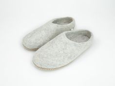 100% wool slippers with a comfortable arch and a flexible sole. These shoes are handcrafted by Nepali Artisans using a 100% wool felt technique and include a thick suede sole that is flexibly movable according to your footsteps and provides support to the base of your feet. Boiled wool-felted slippers are intended for those who prefer a firmer slipper that is easy to put on and take off on any type of floor.  Felt slippers are extremely soft, warm, and cozy, as well as moisture-wicking, which ar Casual Wool Slippers With Leather Sole, Comfortable Felt Slippers With Rubber Sole, Wool Slippers With Rubber Sole And Round Toe, Felt Slippers With Rubber Sole And Round Toe, Felt Slippers With Round Toe And Rubber Sole, Round Toe Felt Slippers With Rubber Sole, Indoor Wool Slippers With Round Toe, Indoor Wool Slippers With Rubber Sole, Felt Slip-on Clogs With Rubber Sole