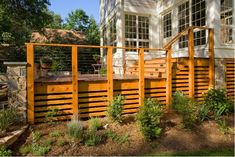 an image of a wooden deck in front of a house