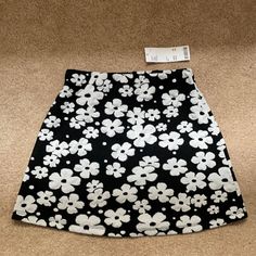 Urban Outfitters Black And White Floral Skirt Size Xs. Never Worn Urban Outfitters White Cotton Mini Skirt, Urban Outfitters Black Mini Bottoms, Urban Outfitters Lined Mini Skirt For Spring, Urban Outfitters Black Mini Skort, Chic White Skort With Floral Print, Fitted Black Skort By Urban Outfitters, Chic Urban Outfitters Mini Skirt For Spring, Chic White Floral Print Skort, Fitted White Floral Print Skort