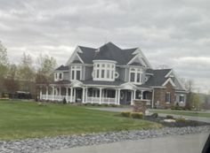 a large house with lots of windows in the front yard