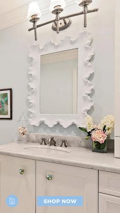 a bathroom vanity with a large mirror above it