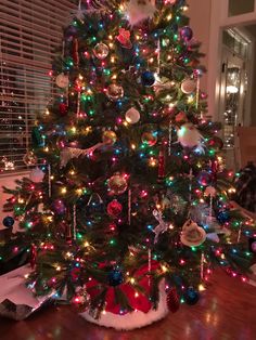 a christmas tree with lights and ornaments on it