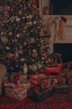 a christmas tree with presents under it