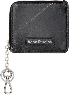 Cracked leather wallet in black. · Logo patch at face · One note slot · Three card slots · Zip closure with lanyard clasp and keyring · Taffeta lining · H4 x W4.5 Supplier color: Black Acne Studios Wallet, Acne Studios Bag, Essentials Logo, One Note, Acne Shop, Logo Ideas, Black Logo, Wallet Men, Lanyard