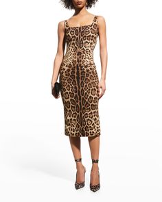 Dolce&Gabbana charmeuse dress in allover leopard print. Scoop neckline. Sleeveless. Bodycon silhouette. Midi length. Back zip. Silk/spandex. Dry clean. Made in Italy. Halterneck Mini Dress, Charmeuse Dress, Leopard Print Fashion, Brown Midi Dress, Calf Length Dress, Dolce Gabbana Dress, Strapless Midi Dress, Bustier Dress, Leopard Dress