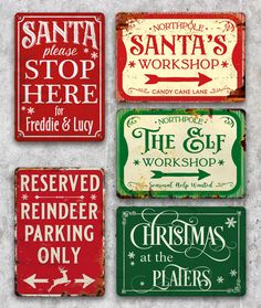 four signs that say santa's workshop, the old fashioned shop and the rest of the