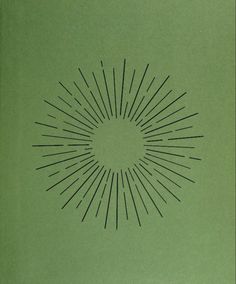 an old book with black lines in the shape of a sunburst on green paper