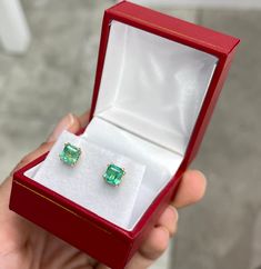 A classic pair of emerald-cut green natural Colombian emerald gold studs in 14K Gold. These earrings feature two lively, natural Colombian emeralds that are handset in a double-prong setting. These stones were sourced by the best emerald mine in the world known as Chivor. They are comfortable to wear and come with secure back pieces. Setting Style: Stud Earrings Setting Material: 14K Yellow Main Stone: Colombian Emerald Shape: Asscher Cut Estimated Total Weight: 1.73 Carats Clarity: Transparent Luxury Green Emerald-cut Earrings, Emerald Cut Gemstone Earrings In 14k Gold, Emerald Cut Emerald Earrings In Yellow Gold, 14k Gold Emerald-cut Gemstone Earrings, 14k Gold Emerald Cut Gemstone Earrings, 14k Gold Gemstone Earrings With Emerald Cut, Luxury 14k Gold Emerald Cut Earrings, Green Baguette Cut Earrings For Gifts, Fine Jewelry Baguette Cut Emerald Earrings