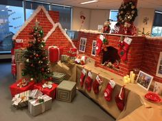 christmas decorations and gifts are on display in an office