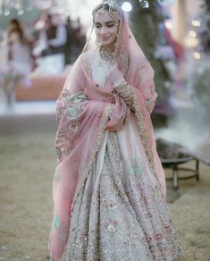 a woman in a pink and white bridal gown