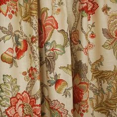 an image of a curtain with flowers and leaves on it's side, close up