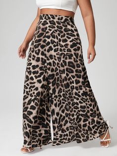 Expertly crafted for the figure, these leopard printed wide leg pants exude confidence and style. Made with high-quality materials for all-day comfort, these pants effortlessly elevate any outfit. With a bold print and flattering wide leg design, these pants are a must-have for any fashion-forward wardrobe. 100% Polyester Zipper Inseam 38.6 Inches Features: plus size, leopard print, wide leg, zip back Fabric has no stretch,but it's soft and comfortable Brand Size Dress Bust Waist Hip XS 0-2 31-32.5'' 23-24'' 31-34" S 4--6 33-35'' 25-26'' 35-37" M 8--10 35-36'' 27-28'' 38-39" L 12--14 38-40'' 29-31'' 40-42" XL 14-16 40-42'' 33.5-36'' 44-46" 2XL 18-20 42-44'' 37-40'' 47-50" 3XL 22-24 44-46'' 41-46'' 51-55" 4XL 26-28 46-48'' 47-50'' 56-60" Leopard Print Pants, Winter Knit Hats, Printed Wide Leg Pants, Print Pants, Plus Size Kleidung, Pantalon Large, Leg Design, Printed Pants, Trendy Fashion Women