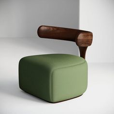 a green chair with a wooden arm rest