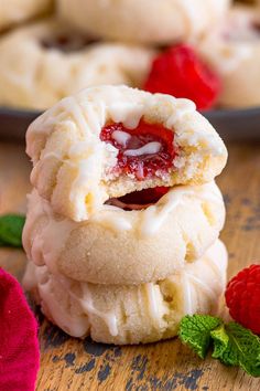 raspberry shortbread cookies stacked on top of each other with one bite taken out