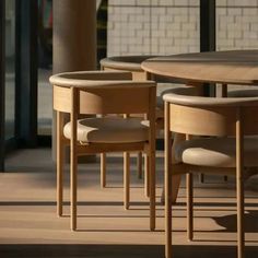 a table with four chairs sitting next to each other