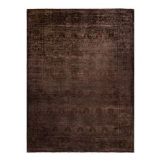 an antique rug with dark brown tones