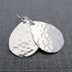 My hammered sterling silver teardrop earrings are hand hammered for a shimmery, reflective finish, with each teardrop hung on a sterling silver ear wire earring. I hand polish the teardrop earrings after hammering. These earrings are great for everyday and make a lovely gift for mom, a girlfriend Wire Earring, Letter Jewelry, Silver Bar Necklace, Initial Earrings, Gold Bar Necklace, Initial Necklace Gold, Hammered Sterling Silver, Tin Gifts, Handcrafted Earrings