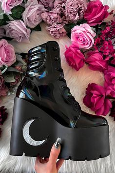 DIANA.- Statement holographic boot.- Platform wedge heel with crescent cut-out.- Lace up closure.- Platform height 7cm/2.7"- Heel height 13.5cm/5.3"with KILLSTAR branding, 93% Polyester 7% Elastane. Cute Black Boots For Women, Goth High Heels, Holographic Boots, Alt Shoes, Demonia Boots, Black Holographic, Goth Shoes, Demonia Shoes, Punk Shoes