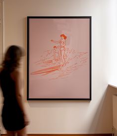 a woman standing in front of a painting on the wall next to a stair case