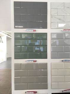 some gray and white tiles are on display