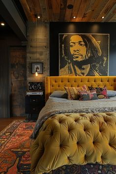 a bedroom with a bed, rugs and pictures on the wall above it in an eclectic style