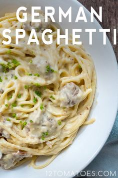 a white plate topped with pasta covered in gravy