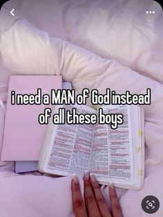 someone is reading a book in bed with the words i need a man of god instead of all these boys