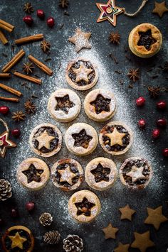 christmas pastries arranged in the shape of a tree on top of a table with decorations