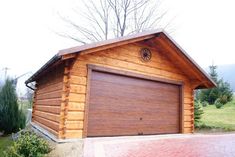 a log cabin with a large garage door