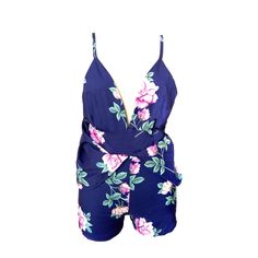 This sweet but sassy romper is absolutely perfect. Featuring a plunging v-neckline, a fitted top with spaghetti straps to an open back and crisscross straps, an empire waist and a flowing open skirt over fitted shorts that fall mid-thigh. This romper pairs perfectly with wedges, heels or sandals to go from a a cute and casual day look to a night on the town. Made with a polyester and cotton blend for comfort and style. Flirty V-neck Jumpsuit For Date Night, Summer V-neck Jumpsuit With Tie Back, Flirty Spring Jumpsuits And Rompers With Spaghetti Straps, Flirty Spring Jumpsuit With Spaghetti Straps, Flirty Spaghetti Strap Jumpsuits And Rompers For Spring, Flirty Spaghetti Strap Jumpsuits For Spring, Flirty Backless Summer Jumpsuit/romper, Flirty Backless Jumpsuit For Summer, Flirty Backless Jumpsuits And Rompers For Spring