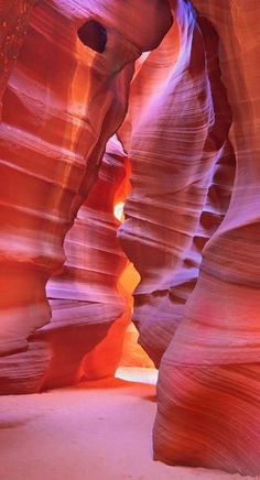 the light is shining through the slot in the canyon