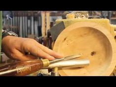 a person is working on a wooden object