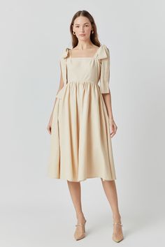 This linen midi dress is sweet as a summer breeze. Its shoulder bow tie adds a playful twist while a square neckline and back smocking detail give it a vintage vibe perfect for sunny days. In a midi length it's modest yet flirty pair it with espadrilles for a casual brunch or dress it up with wedges for an evening stroll. Whether you're sipping sangria in Barcelona or touring Tuscany's countryside this dress will keep you looking chic and feeling cool as temperatures rise. Best of all linen fabr Spring A-line Midi Dress With Tie Straps, Square Neck Linen Midi Dress With Smocked Back, Summer Midi Dress With Straight Neckline For Brunch, Spring A-line Midi Dress With Bow, Spring Midi Dress With Tie Straps For Garden Party, Spring Day Out Linen Dress With Square Neck, Chic Spring Linen Dress With Smocked Back, Chic Linen Dress With Smocked Back For Spring, Spring Linen Dress With Square Neck For Day Out