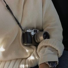 a person holding a camera in their hands