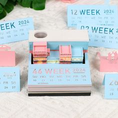 a table topped with lots of pink and blue items