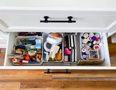 the drawers are organized with craft supplies such as paint, scissors and other things in them