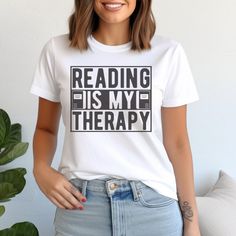 Reading is My Therapy Tshirt Book Lover Gift for Women Reading T-Shirt Graphic Cute Book Tshirt Book Nerd Shirt Reading Themed Gift Shirt Our "Reading is My Therapy" t-shirt, is the comfiest shirt to wear when indulging in the therapeutic joy of reading. It is the perfect gift for any book lover's special occasion, promoting literacy and mental health. 🍍𝗣𝗥𝗢𝗗𝗨𝗖𝗧 𝗜𝗡𝗙𝗢𝗥𝗠𝗔𝗧𝗜𝗢𝗡: * Exact Measurement Info in Listing Photos * Bella Canvas Unisex Short Sleeve Tee * Runs True to Size * Crew Neck Shirt With Text Print, Bookish Crew Neck T-shirt With Letter Print, Bookish Crew Neck Shirt With Letter Print, Bookish Crew Neck Shirt With Text Print, Bookish T-shirt With Funny Print And Short Sleeves, Bookish Cotton T-shirt With Slogan, Bookish Short Sleeve T-shirt With Funny Text, Bookish Crew Neck Shirt With Graphic Print, Bookish Crew Neck T-shirt With Funny Print