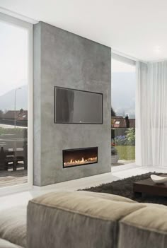 modern living room with fireplace and large windows