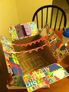 an open cardboard box sitting on top of a wooden table