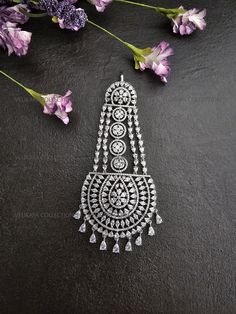 Stunning American diamond pasa or hair jewelry made with highest quality cubic zirconia stones. High quality silver plating. Length  - 4.5 Inches Width - 2 Inches Style Tip: Wear with statement earrings or a full CZ necklace set to add glamour to your wedding lehenga. ----------- CARE ----------- - Store in air tight zip lock bags - Do not expose to moisture/water - Do not spray chemicals or perfumes on the jewelry Please feel free to contact us if you have any questions. * We sell high quality imitation jewelry only. All measurements are approximate. Please note that all sales are final. Thank you Traditional Silver Bridal Earrings With Cubic Zirconia, Hand Set Silver Diamond Bridal Earrings, Hand Set Diamond Bridal Earrings In Silver, Silver Diamond Bridal Earrings Hand Set, Silver Cubic Zirconia Tikka For Wedding, Silver Cubic Zirconia Wedding Tikka, Silver Cubic Zirconia Tikka, Elegant Bridal Accessories With Stone Work In Silver, Elegant Silver Bridal Accessories With Stone Work