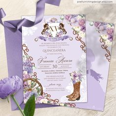 an elegant purple and white wedding card with flowers on it, next to a purple flower