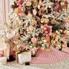 a decorated christmas tree with presents under it